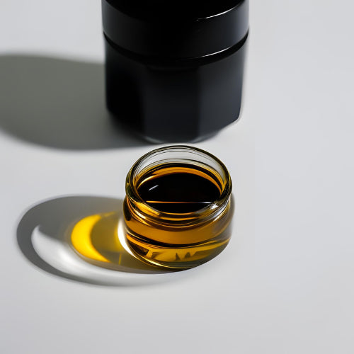 Black seed oil in glass jar