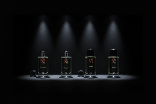ÈLIXIR CRÈME, MOONLIGHT ELIXIR, NOMAD and OPULENT Extrait de Parfum collection lineup on black surface — Royal Aroma Oud luxury fragrance range UK